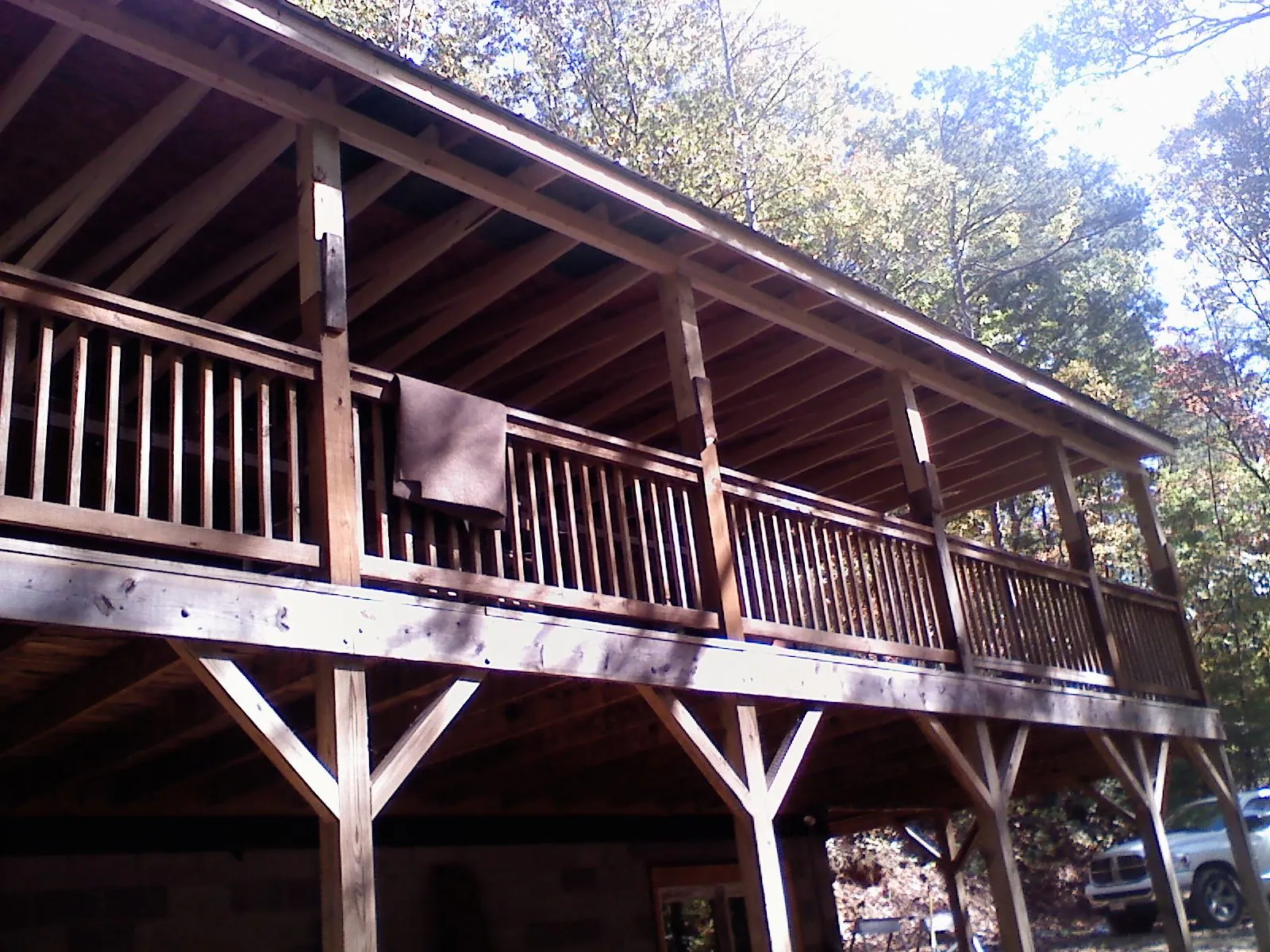 Timber framing under a new elevated porch and deck — Roof Leak Repair in Herscher by Roofing Brothers